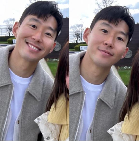 Son Heung-min then happily signed another shirt before taking a photo with the female fan